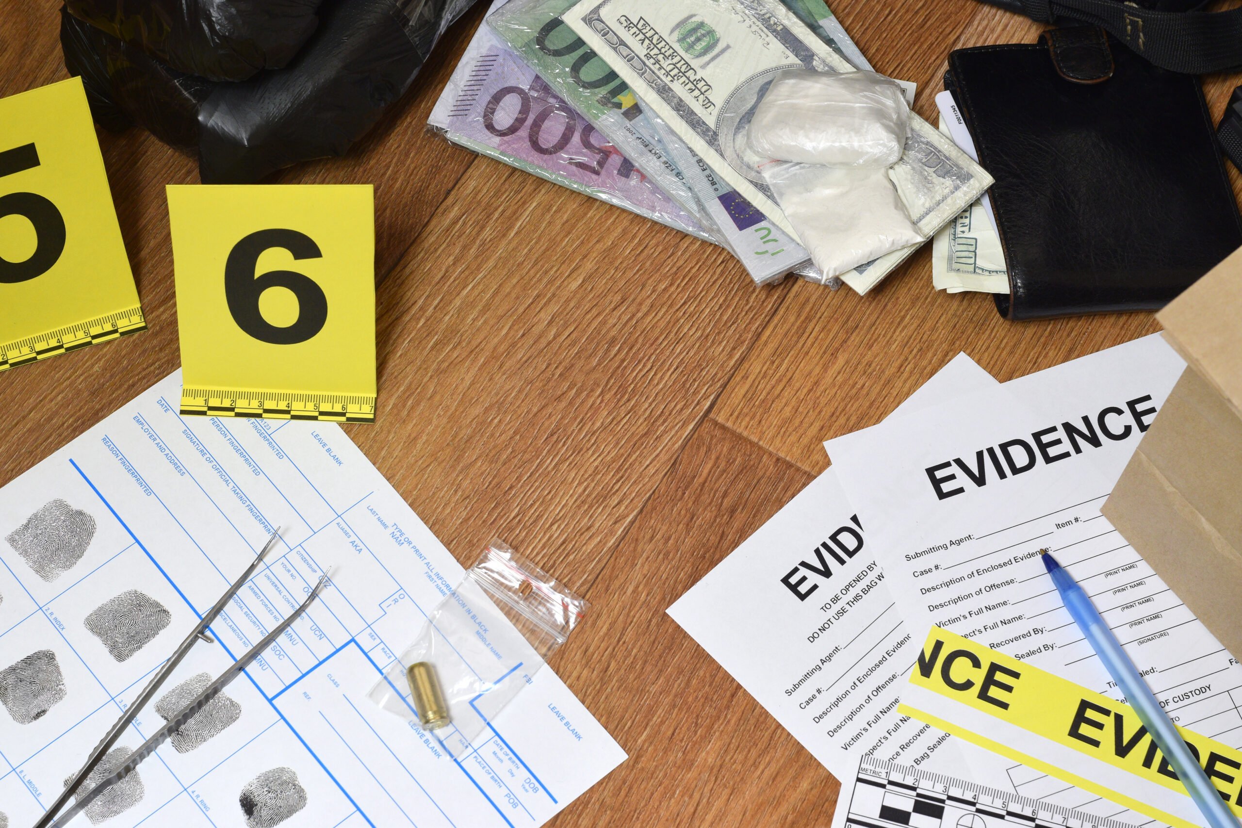 Evidence Chain of Custody Labels and brown paper bag with fingerprints applicant card lies against big heroin packets and packs of money bills as evidence in crime scene investigation process close up